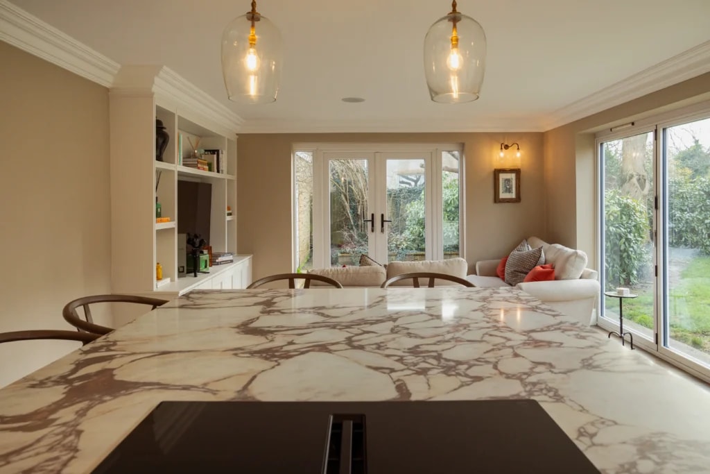Calacatta Viola engineered stone island worktop overlooking the open-plan living area in Lancashire