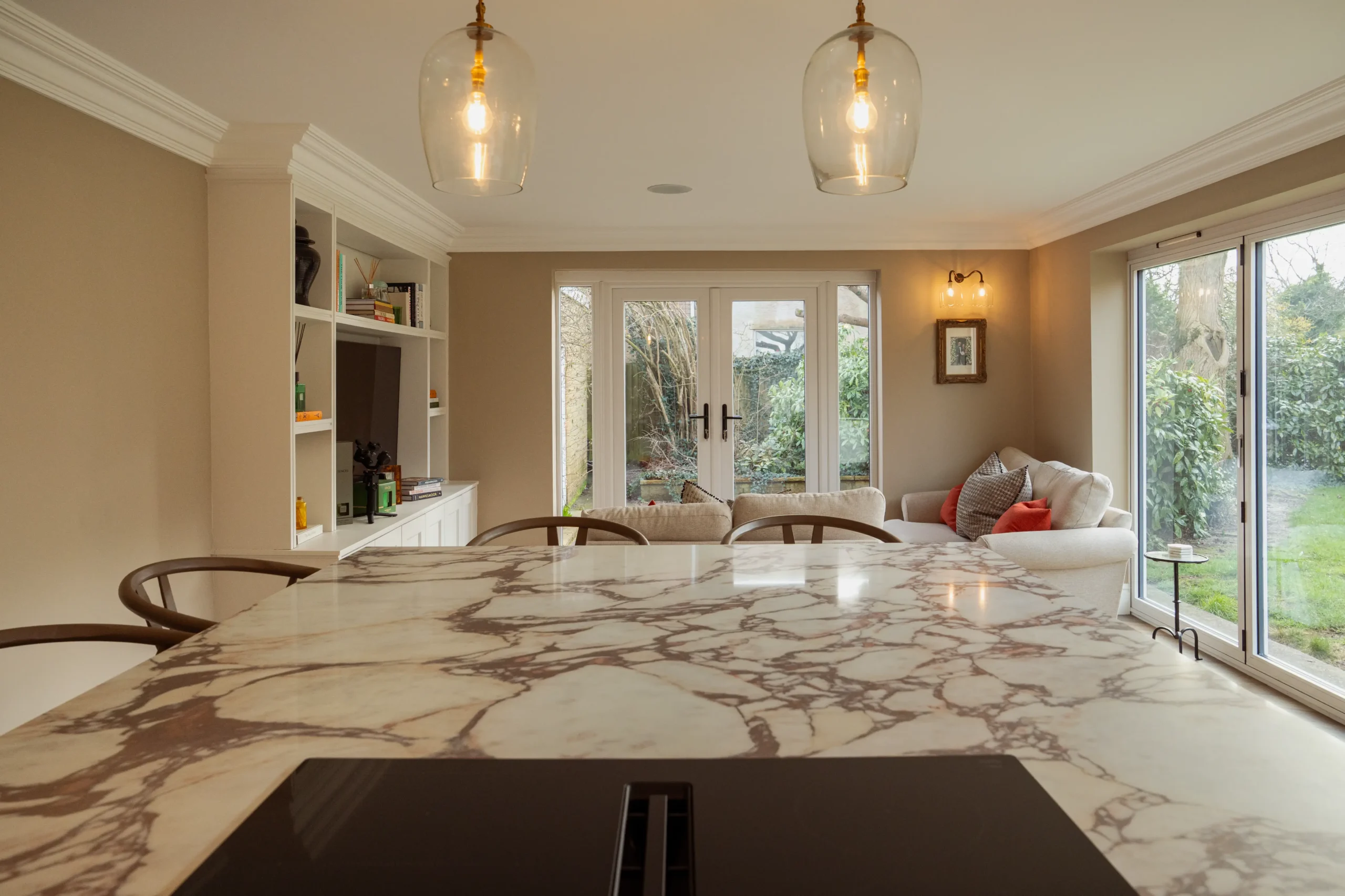 Calacatta Viola worktop showing deep burgundy veining across a warm ivory base