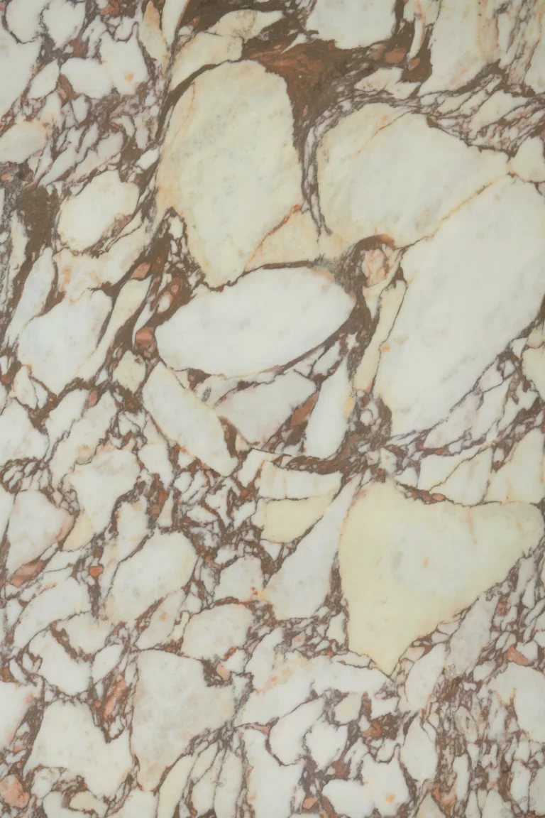 Calacatta Viola worktop with deep burgundy veining across a warm ivory base