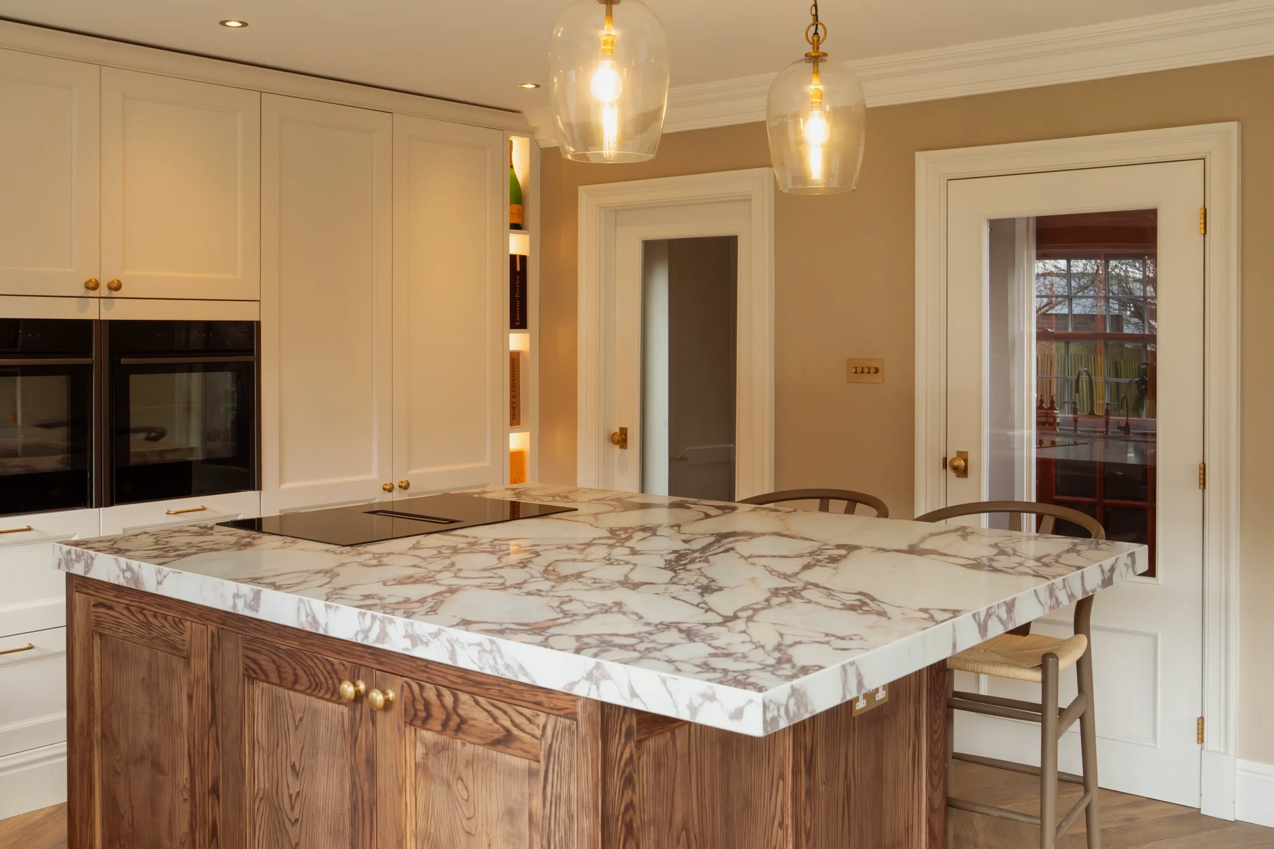 Calacatta Viola worktop showing deep burgundy veining across a warm ivory base