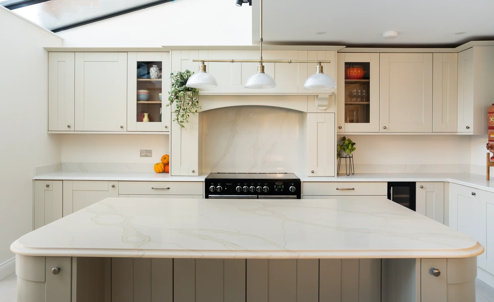 Calacatta Gold worktops with rounded island edges in Hertfordshire