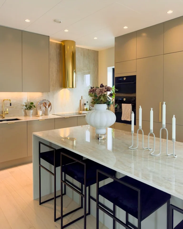 Contemporary kitchen featuring SINTERRA breakfast bar and island