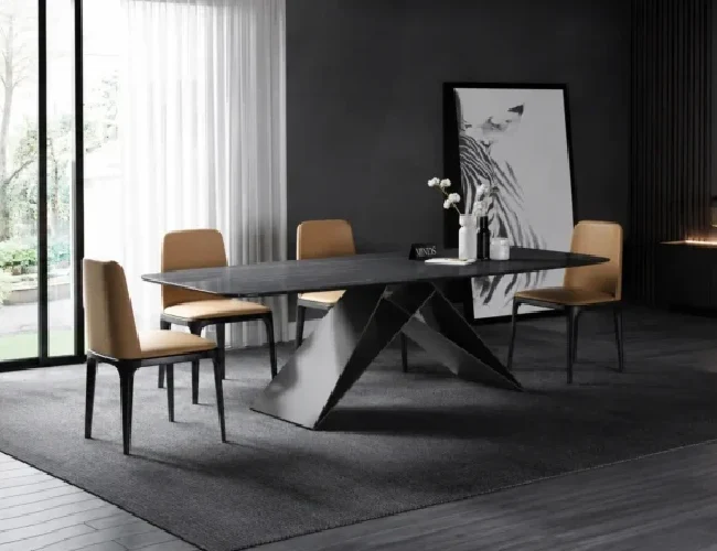 Nexus bespoke stone dining table with dark stone surface and angular metal base