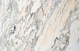 Full slab view of Rosa Arabescato marble worktop with soft blush undertones and expressive veining