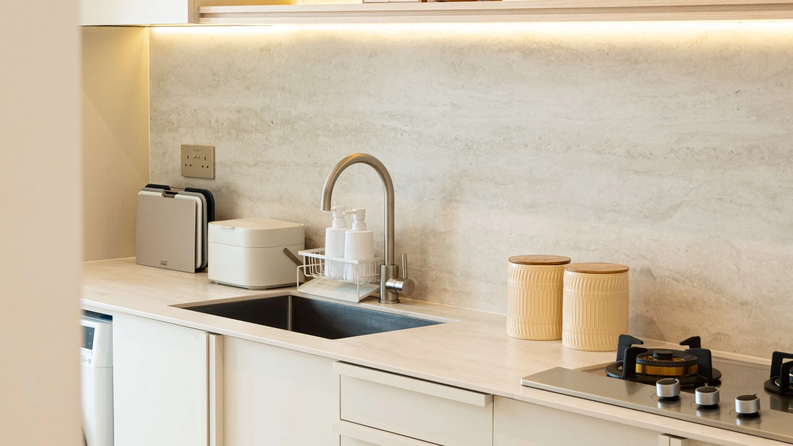 Travertine sintered stone worktop in a kitchen setting