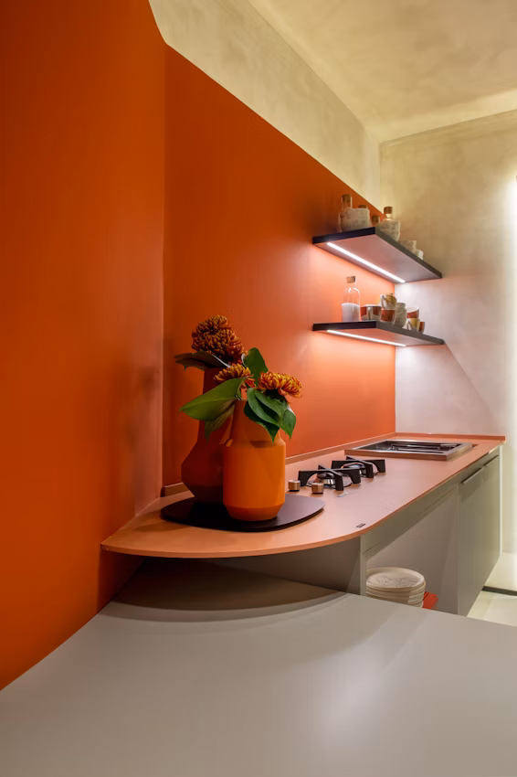Umber Dekton shelf surface against terracotta wall