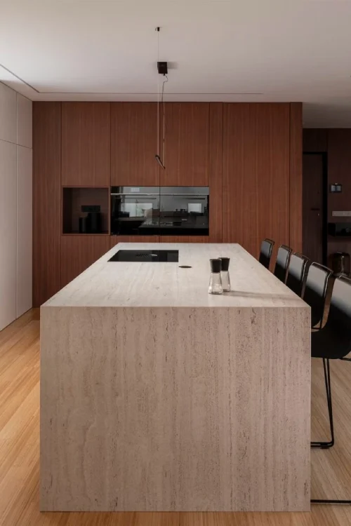 Luxury kitchen featuring DEKTON stone island with warm timber cabinetry