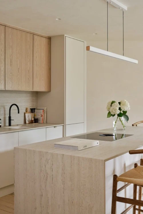 Minimal oak kitchen with DEKTON island worktop and integrated breakfast bar