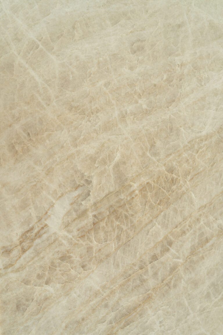 Taj Mahal Quartzite worktop with soft beige tones and flowing veining