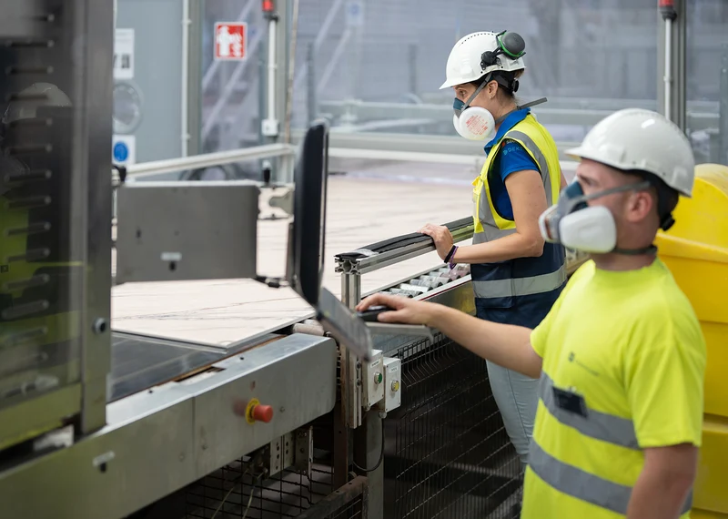 Workers working in Mo's Stonex warehouse