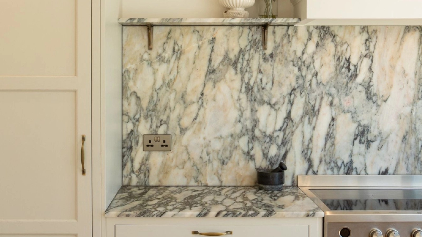 Honed Calacatta Monet marble worktop and full-height splashback
