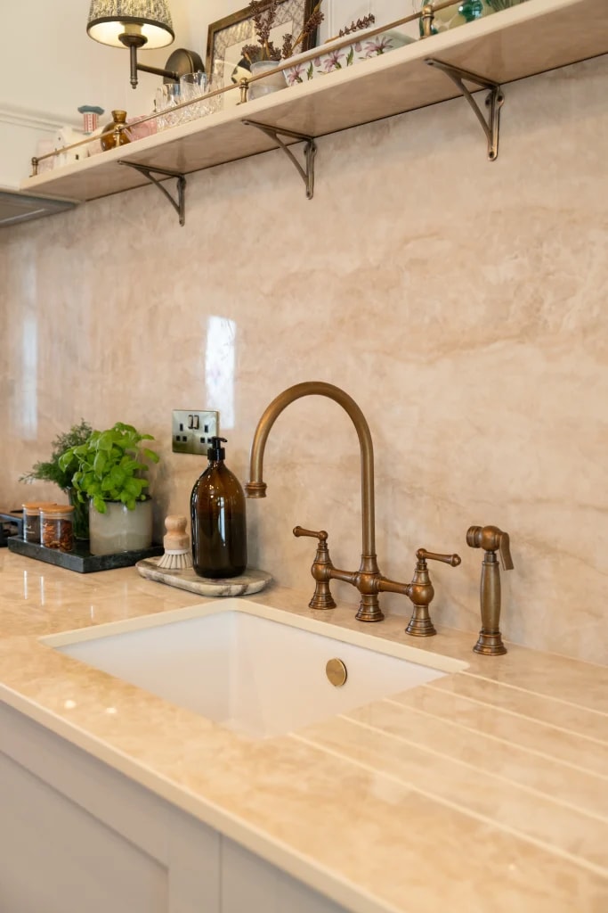 Close-up of the SINTERRA Crema worktop beside the kitchen sink