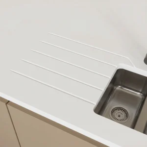 Angled drainage grooves in stone worktop