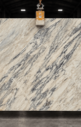 Calacatta Monet natural marble slab with ivory background and flowing grey veining